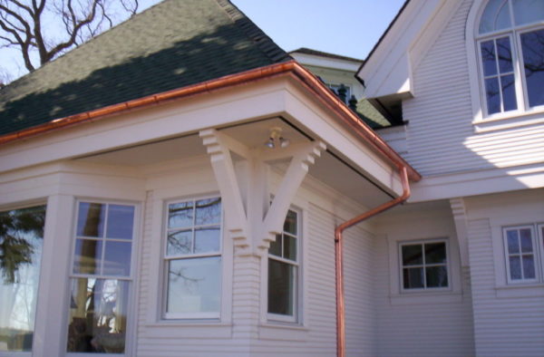 Copper gutter installation on home